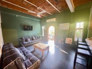 a living room with a couch and a table at Apartamento Parota # in Sayulita