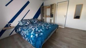 Postel nebo postele na pokoji v ubytování Le Nid de la Baie