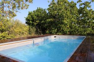 a swimming pool sitting on top of a house at Chiusa del prete 1867 in Noto