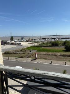 a view of the beach from a balcony at La Belle Escale in Pauillac +6 photos