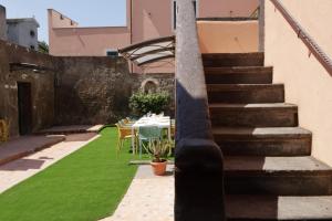 a staircase leading up to a patio with green grass at Casa Flaùti Sorrento in Piano di Sorrento