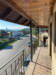 a wooden porch with a view of a street at Casa Rizea 
