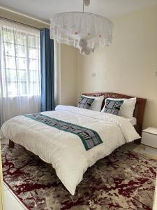 Ένα ή περισσότερα κρεβάτια σε δωμάτιο στο CJ Suites - Executive 2Br Near JKIA and SGR