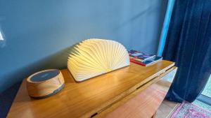 a yellow shell sitting on top of a wooden table at Poets Tavern & Inn in Avô +9 photos