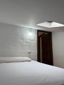 Postel nebo postele na pokoji v ubytování A Casa do Peregrino + 1 fotografie