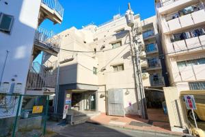 a white building with balconies on the side of it at NC-302Yamanote Line shinjuku 高田馬場 5mins walk Hostel! 高速Wi-fi! Waseda in Tokyo