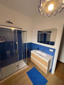 a bathroom with a sink and a shower at Una Rotonda sul Mare in Formia +14 photos