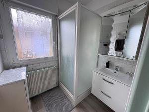 a white bathroom with a sink and a mirror at Séjour détente et confort au calme d une impasse in Garges-lès-Gonesse +68 photos