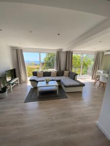 a living room with a couch and a table at Apartman Lana in Sutomore
