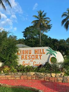 a sign for a hog hill resort and soda center at Libhu Hill Resort and Sports Complex in Maasin +55 photos