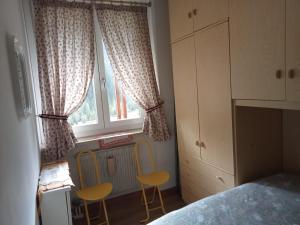 Ένα ή περισσότερα κρεβάτια σε δωμάτιο στο Casa Bergamo Auronzo