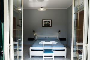 Postel nebo postele na pokoji v ubytování Palia's Hotel