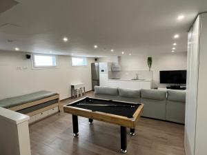 a living room with a couch and a pool table at Loft Puerto Real in Puerto Real