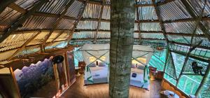 an overhead view of a room in a bamboo building at Casa del árbol - Kiosko el Tacana in Leticia +23 photos