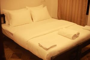 Ένα ή περισσότερα κρεβάτια σε δωμάτιο στο Fort Verdant Homestay +17 φωτογραφίες