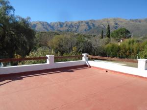 a white bench sitting on top of a roof at Hostería de los Césares in Merlo
