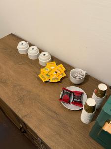 a wooden table with a group of items on it at Sc Residence Parma in Parma +30 photos