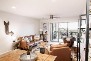 a living room with a couch and a table at 183 Beach Club Villa - Fripp Island Coastal Retreat in Fripp Island