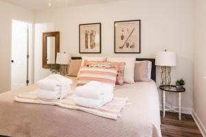 a bedroom with a large bed with white sheets and pillows at 183 Beach Club Villa - Fripp Island Coastal Retreat in Fripp Island +64 photos