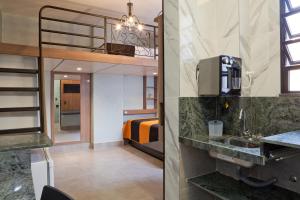 a hotel room with a bunk bed and a bathroom at LOFT LAPA Baldô in Rio de Janeiro