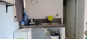 a small kitchen with a sink and a counter top at Villa Colonial room 1 in Río San Juan