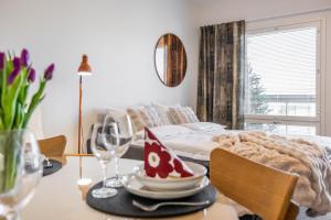 a dining room table with a plate of food on it at Unique apartment - Best location with Sauna in Rovaniemi