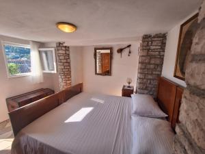 a bedroom with a bed in a room at House Zarko in Pučišća
