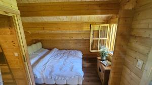 Ένα ή περισσότερα κρεβάτια σε δωμάτιο στο Poloniny Osadne