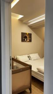 a bedroom with a bed and a mirror at The Urban Nest Central Skopje Cozy 2BR Ap in Skopje