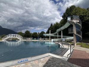 a water slide in a swimming pool at Alpenlodge Haus - Summer resort with Schladming-Dachstein Card in Haus im Ennstal