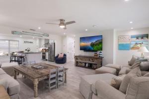 a living room with a couch and a table at Surf Riders home in Holmes Beach