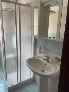 a bathroom with a sink and a shower at Casa Vacanze - Oliveri - Sicilia in Oliveri