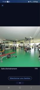 a screenshot of a gym with a picture of a gym at Bel appartement dans un complexe prestigieux Marina Golf in Asilah