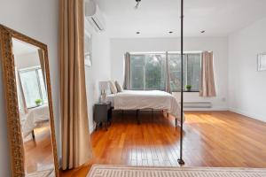 Ένα ή περισσότερα κρεβάτια σε δωμάτιο στο Bowery Two Bedroom