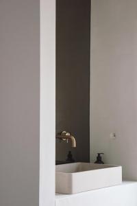 a bathroom with a white sink and a mirror at Villa Kint in Damme +29 photos