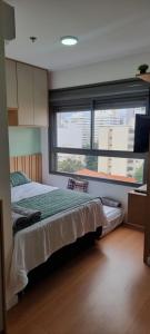 Una cama o camas en una habitación de Studio Novo com Academia em Perdizes - Allianz 5min a pé