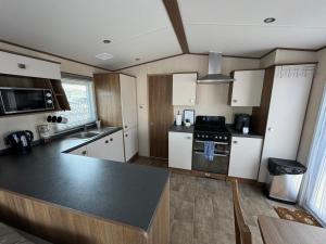 Køkken eller tekøkken på Sandy Haven + 10 billeder