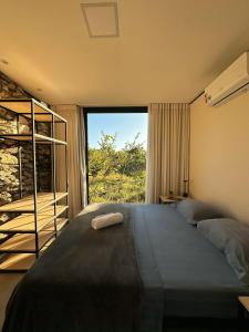 Ένα ή περισσότερα κρεβάτια σε δωμάτιο στο Casa Melodia - AC, Rio e Ofuro Cavalcante