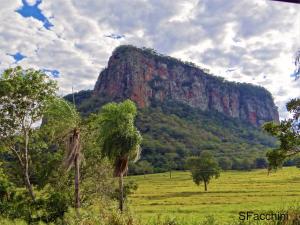 a large mountain in the middle of a field at Pesqueiro Miko-in Rio Aquidauana in Aquidauana