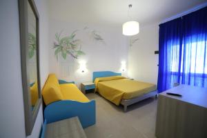 Postel nebo postele na pokoji v ubytování Hotel Albatros