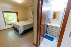Katil atau katil-katil dalam bilik di A Casita Imbassai, localização estratégica em um espaço com encanto +45 gambar