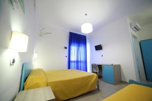 Postel nebo postele na pokoji v ubytování Hotel Albatros