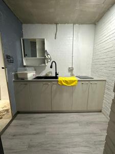 a kitchen with a sink and a faucet at 基隆正榮003 in Pa-ch'ih-men +40 photos