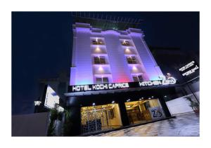 a building with purple lights on top of it at Hotel Kochi Caprice in Cochin