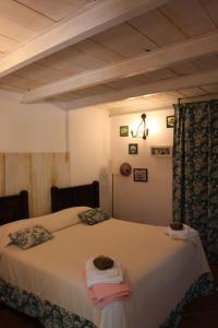 A bed or beds in a room at La Masseria
