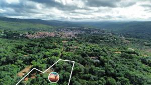 an aerial view of a city in the forest at Pousada Luar do Sertão in Lençóis