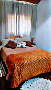 Ένα ή περισσότερα κρεβάτια σε δωμάτιο στο Chalé 2 bukadin de terra