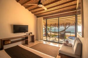 a living room with a view of the ocean at Casa Lu Hotel Boutique in Mazunte