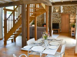 a dining room with a white table and white chairs at The Horse Gin - Uk11024 in East Worlington