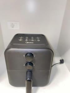 a close up of a electronic device on a table at Bello y confortable Apartamento con Parking in Encarnación